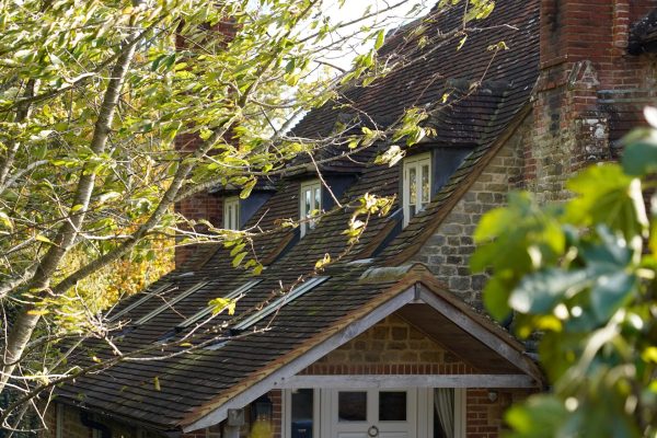 Sussex Listed Farmhouse front door canopy through trees